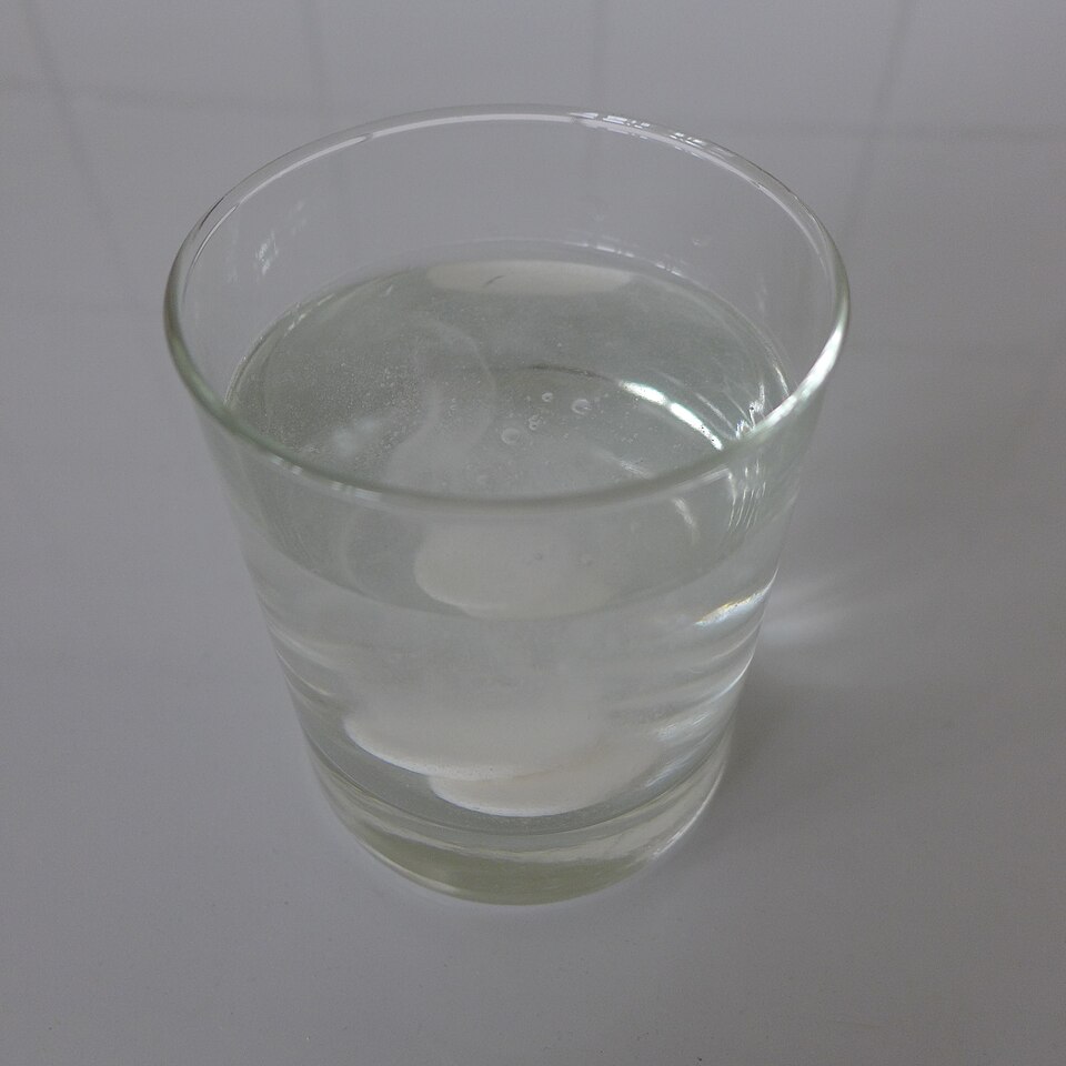 An effervescent tablet fizzing in water